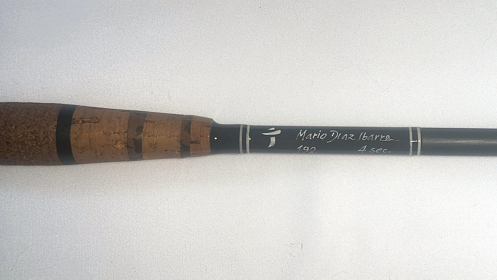 Banded cork handle and hand-engraved "Mario Diaz Ibarra · 192 · 4 sec" signature on the Tenkara R6 limited edition rod, numbered 6 of 24