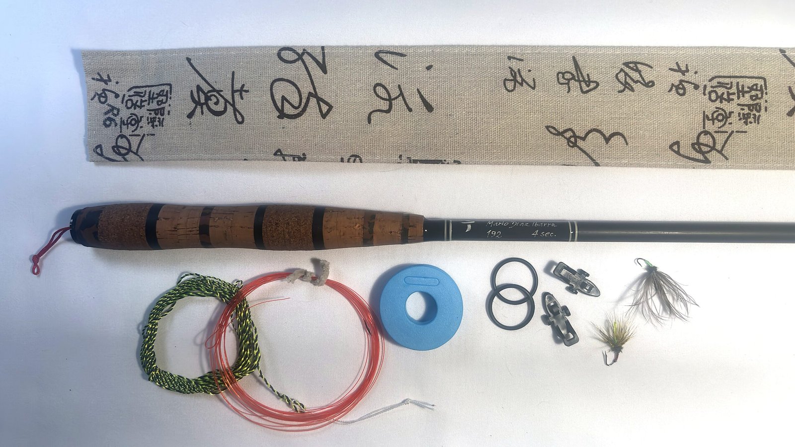 Handmade Tenkara R6 rod with banded cork handle, numbered 6 of 24, folds to 59cm closed, with unique hand-stitched calligraphy-print fabric case and gift set