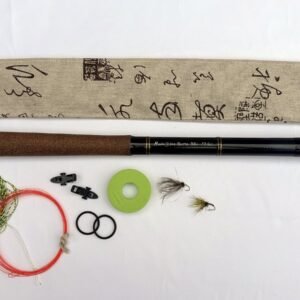 Handmade tenkara rod R22 extended next to its sleeve, line, flies and accessories